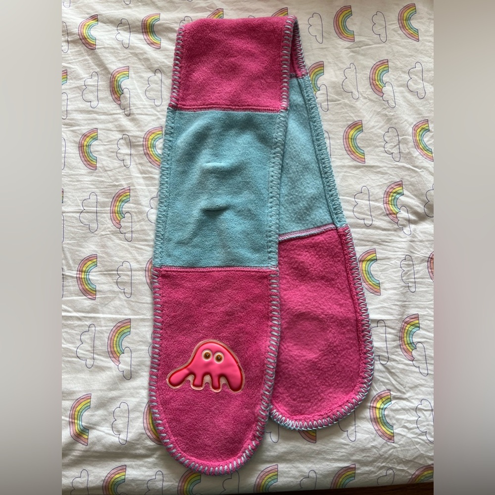 Oilily fleece block scarf featuring little amoeba guy
